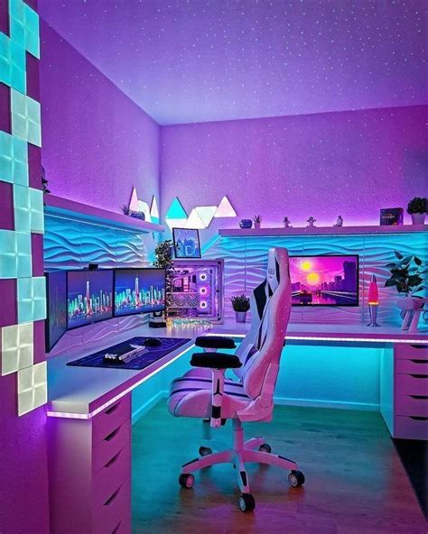 a purple and blue room with a desk, chair, computer monitor and lights in it