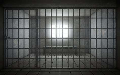 Prison Cell With Light Shining Through A Barred Window Stock Photo ...