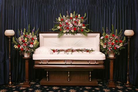 A "full set" of floral designs for an "open casket" service. A "full ...