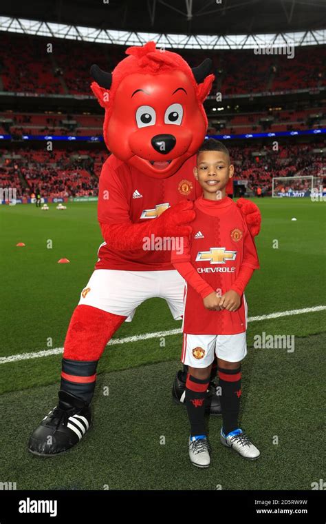 Manchester United club mascot Fred the Red (left) and Manchester United ...