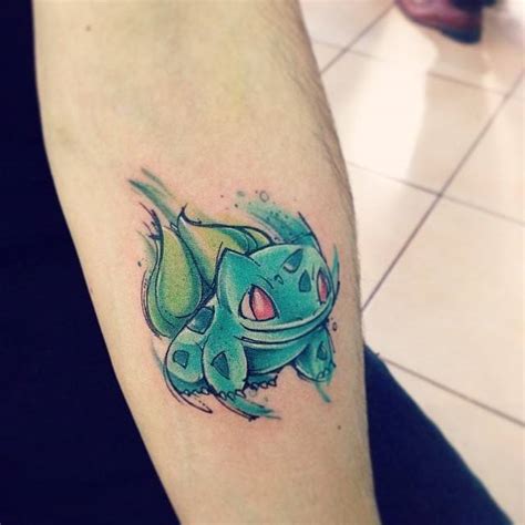 Watercolor style bulbasaur tattoo on the forearm.