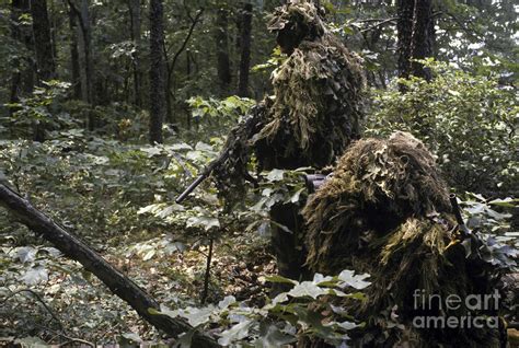 A Marine Sniper Team Wearing Camouflage by Stocktrek Images