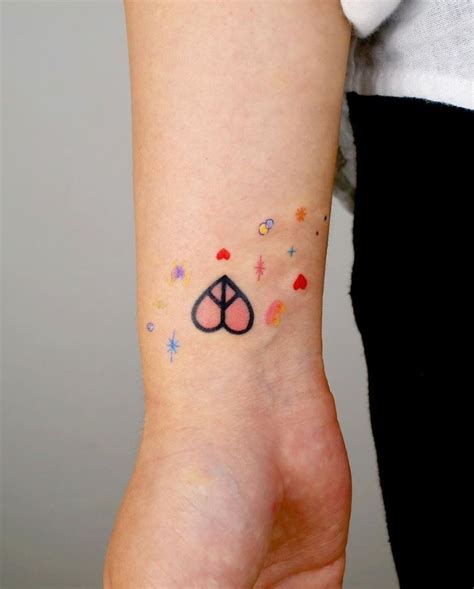 Peace Heart Tattoo | InkStyleMag