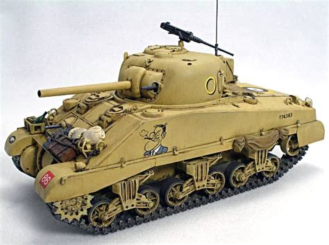 a toy army tank is shown on a white surface with an antenna attached to it