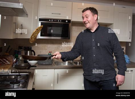 Man tossing pancakes Stock Photo - Alamy