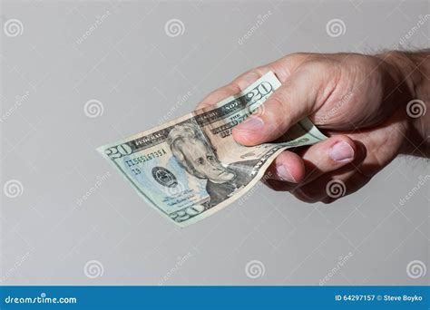 Man Giving Twenty Dollar Bill Stock Image - Image of financial, finance ...