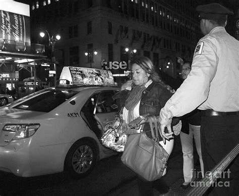 Taxi Frenzy - New York City at Night Photograph by Miriam Danar