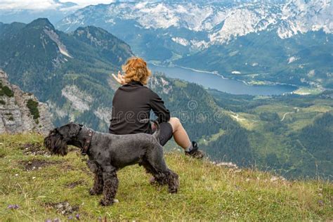 Hikers with Dog in the Austrian Alps Walk on Mountain Hiking Trails in ...