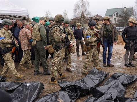 Ukrainian investigators start exhuming bodies from Bucha mass grave ...