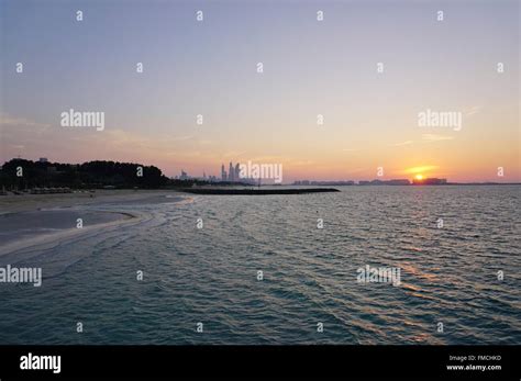 Sunset over the Dubai skyline Stock Photo - Alamy