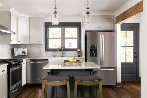 Dark Kitchen Cabinets With White Island And Gray Wall