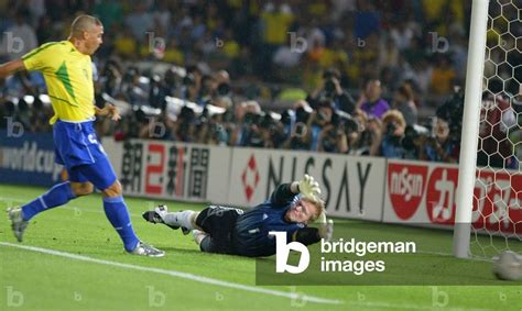 Image of BRAZIL'S RONALDO SCORES PAST GERMAN GOALKEEPER KAHN DURING THE WORLD CUP