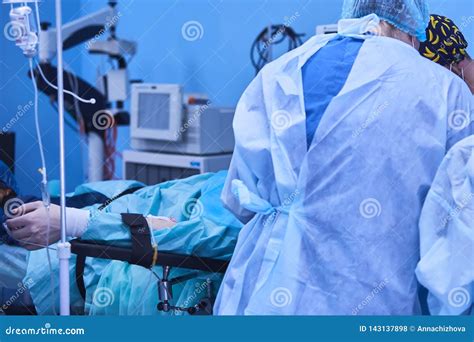 Serious Surgeons during a Surgery in the Hospital. Cross Process Stock Photo - Image of mask ...