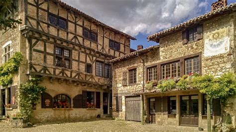 Perouges, France - Beautiful view of old buildings in the main square ...