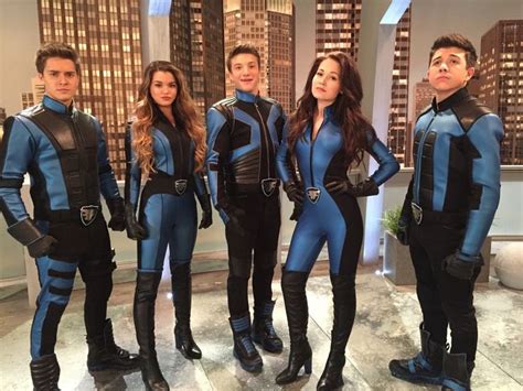 the young actors are dressed in blue and black outfits, posing for a ...