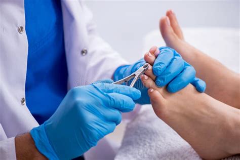 Podiatrist Treating Feet during Procedure Stock Photo - Image of ...