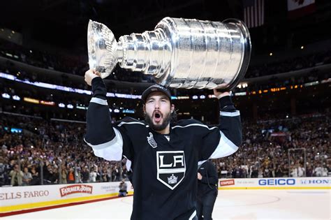 Download Drew Doughty With Shocked Expression Carrying The Stanley Cup ...