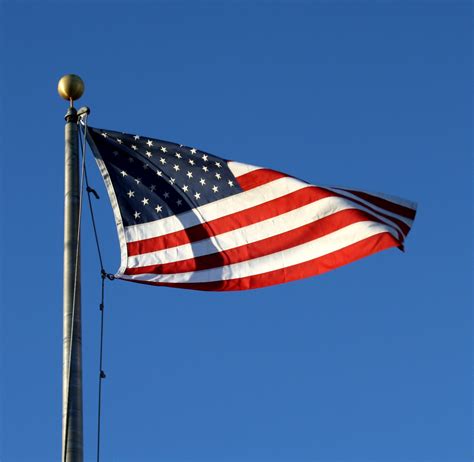 American Flag Flying High – Photos Public Domain