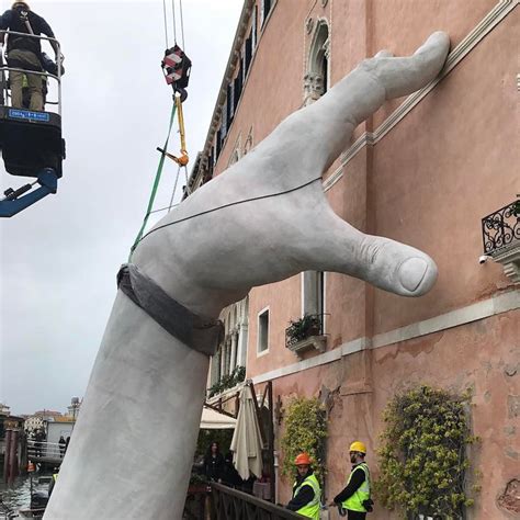 Contemporary Sculpture by Lorenzo Quinn Emerges from Venice's Lagoon