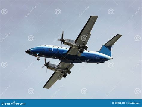 Prop plane landing stock photo. Image of flaps, clouds - 28272488