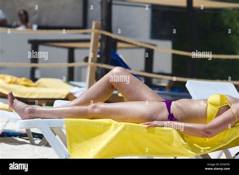 Tanning on the beach Stock Photo - Alamy