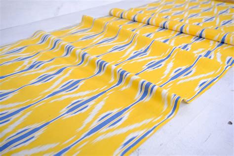 Discover the Ikat Designer Yellow Oriental Fabric