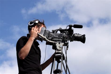 Cameraman filming editorial stock photo. Image of microphone - 15911778