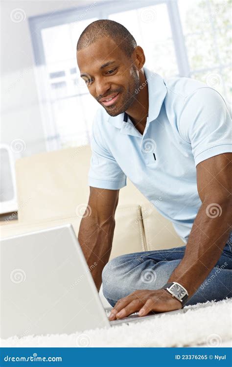 Smiling Man with Laptop Computer Stock Image - Image of face, domestic: 23376265