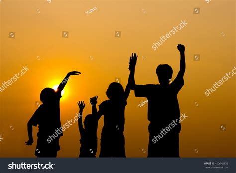 Silhouette Kids Playing Together Sunset Stock Photo 410648332 ...