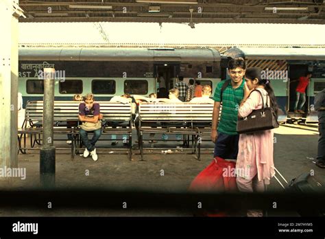 Passengers couple having conversation as they are standing on passenger ...