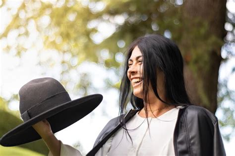 Premium Photo | Portrait of cute smiling girl in hat outdoors close up ...