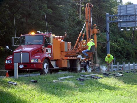 Guardrail Post Installation with Rock Drill | L. S. LEE, INC.