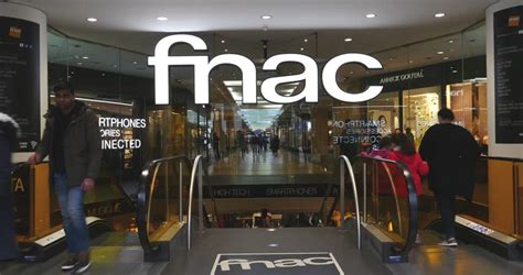 PARIS, FRANCE - DEC 4, 2014: People Passing Near FNAC Facade On Champs-Elysee. FNAC Is The ...