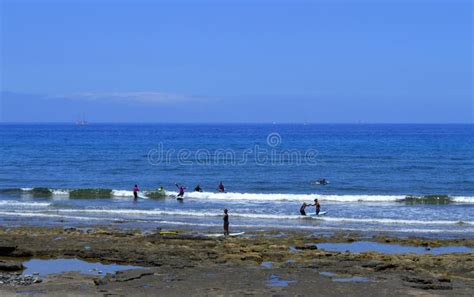 Surfing on Playa De Las Americas Beach Stock Image - Image of boards, people: 75022929