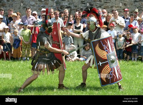 Roman legionnaire are fighting with swords during the historical ...