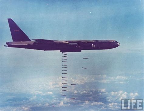 American B-52 dropping payload of bombs onto Viet Cong positions during the Vietnam War.3-1968 2 ...