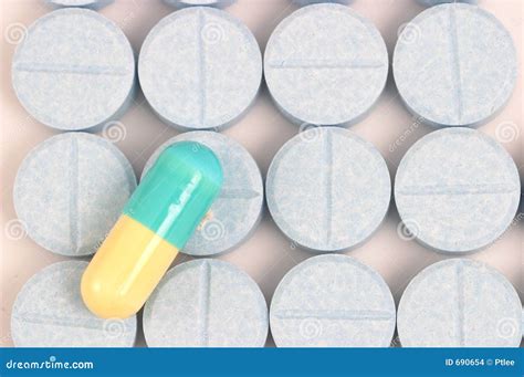 Blue Yellow Capsule on Blue Pills Lined Up Stock Photo - Image of blue ...