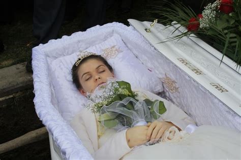 Andreea Brazovan in her open casket during her burial. in 2020