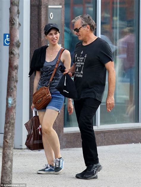 Viggo Mortensen enjoys a romantic stroll with his beau Ariadna Gil as ...