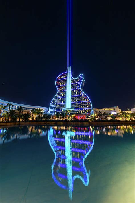 The Guitar Hotel at Night Photograph by Claudia Domenig | Fine Art America