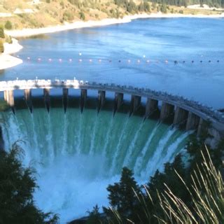 a large dam with water pouring out of it