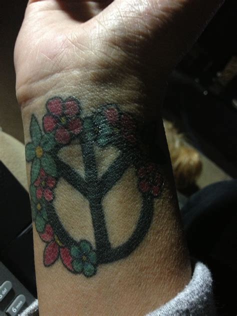 Flower peace sign | Triangle tattoo, Deathly hallows tattoo, Peace sign