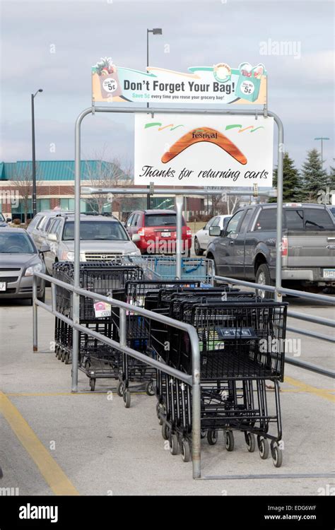 Shopping carts trolleys in supermarket parking lot Stock Photo - Alamy