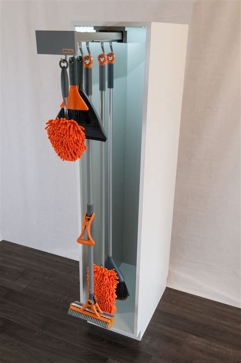 Glideware stores your mops, brooms and other cleaning items by keeping them in line and of ...