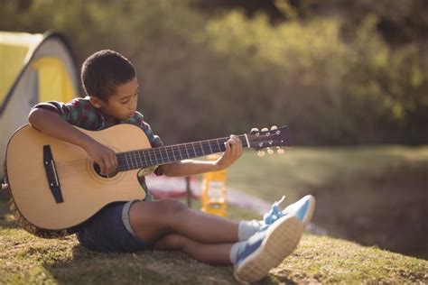 Play the guitar little boy Stock Photo free download