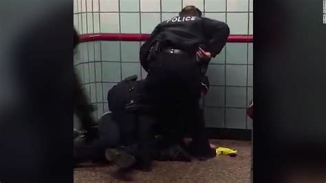 Video shows police officers shooting a man in a Chicago train station ...