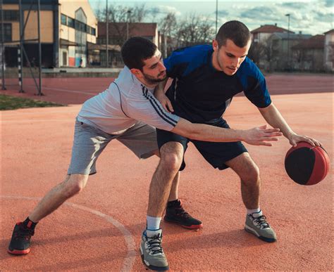 Two basketball players playing basketball - Discovery Eye Foundation