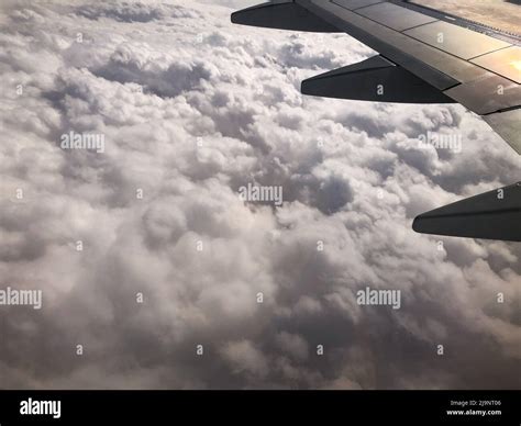 Aerial view of clouds from a plane window Stock Photo - Alamy