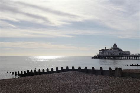 Eastbourne Pier and beach Photograph by Nelly Ross - Fine Art America