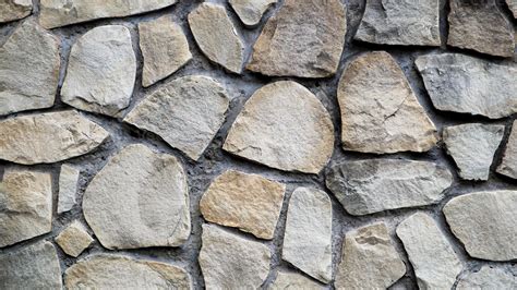 The texture of the stone wall. Old castle stone wall texture background. Stone wall as a ...